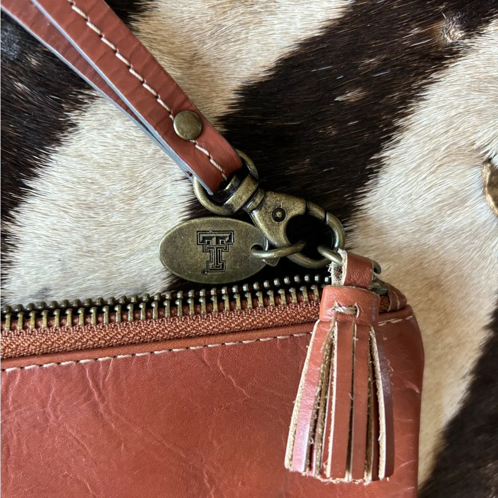 Jack Mason brand leather wristlet. Great‎ condition Texas Tech emblem removable.